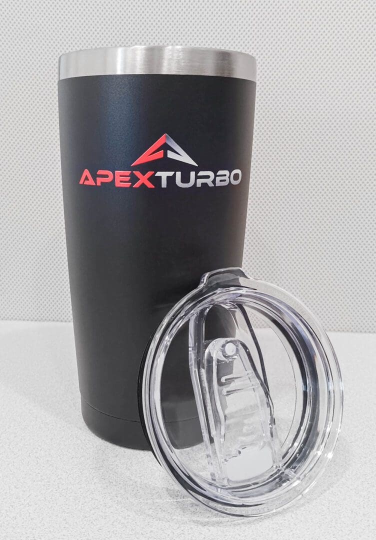 A black Tumbler with the logo apex turbo.